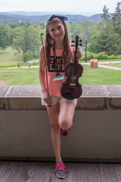 Fourteen-year-old Kiara Williams of Rock Cave, West Virginia has been playing fiddle for two years and recently won the youth fiddle championship at the Vandalia Gathering in Charleston.