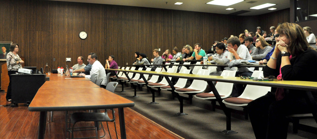 Dr. Crystal Krause, assistant professor of biology and environmental science at Davis & Elkins College, standing, explains some of the many uses of geographic information systems (GIS). The College hosted its second annual GIS Day on November 18 with presentations by area residents who explained how they use the technology in their careers.