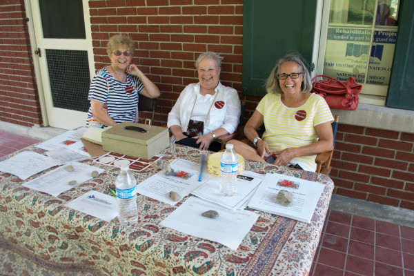 Volunteers at the Kump Center Fair on the Lawn greet folks with smiling faces. Photo by Andrew Carroll.