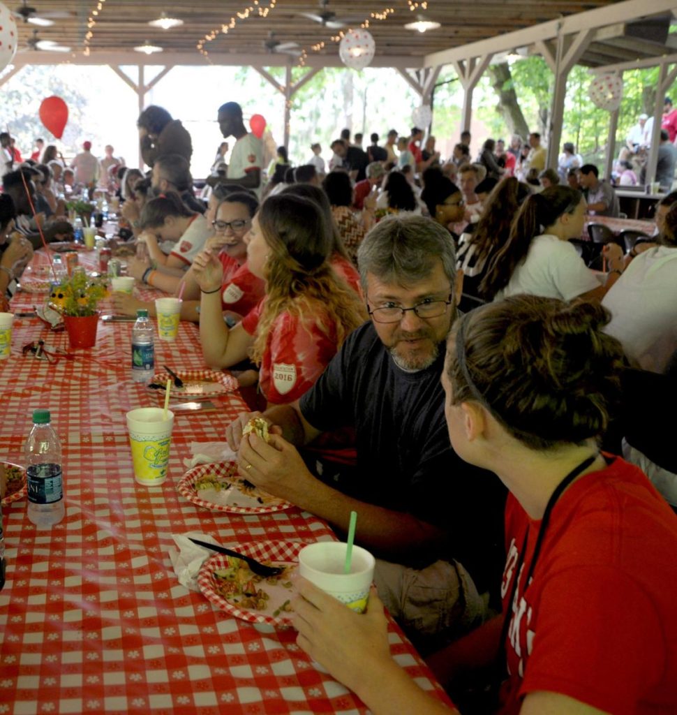 Photo Caption: Davis & Elkins College students enjoy a picnic with faculty and staff in the open-air Augusta Dance Pavilion.  