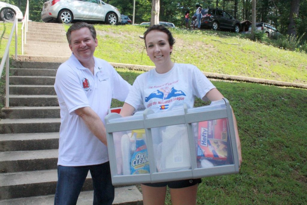 Photo Caption: Davis & Elkins College President Chris Wood helps student Lauren Gorsuch carry items to her residence hall. Gorsuch is a member of the women’s lacrosse team. 